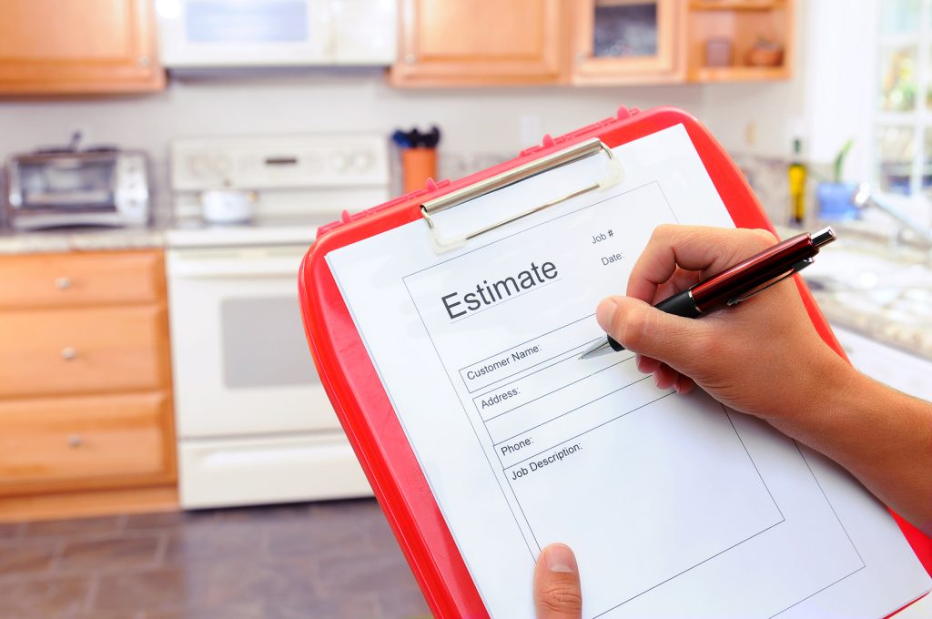 Closeup of a contractors clipboard as he writes up an estimate f