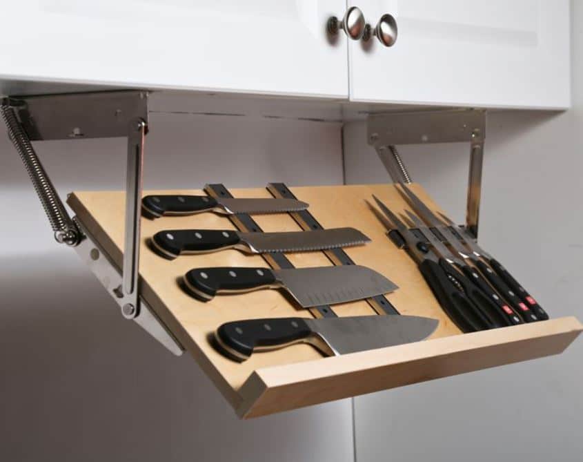 A pull-down under cabinet knife rack