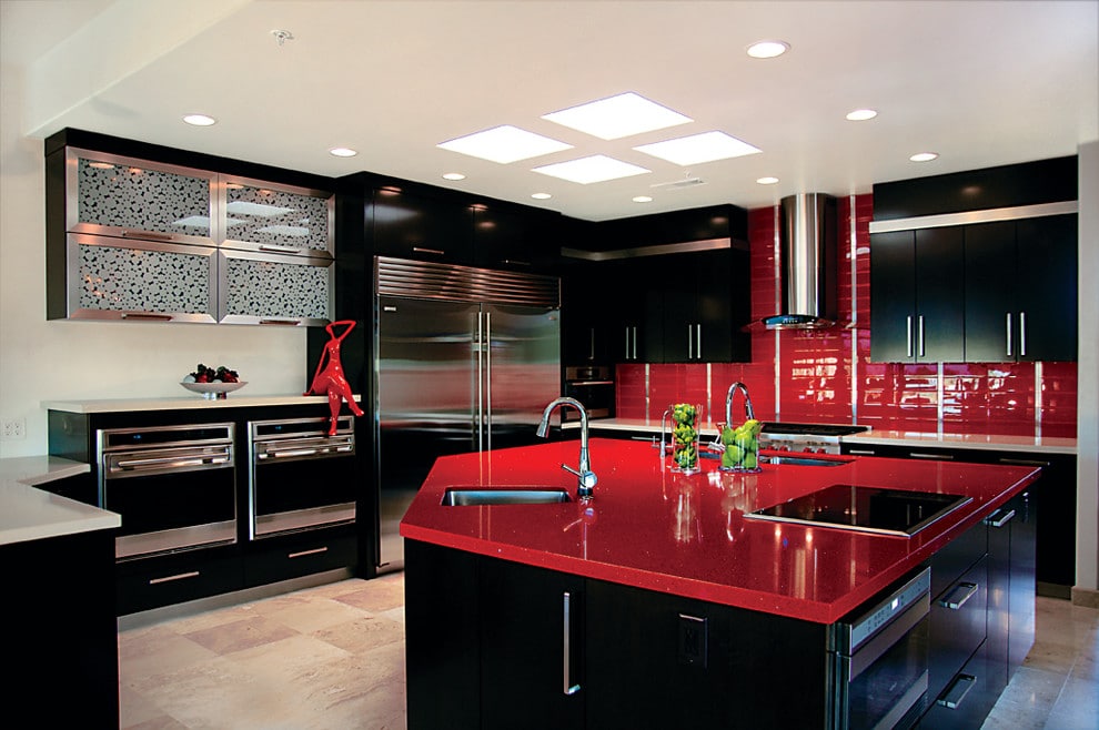 accented-blood-red-countertop-black-kitchen-cabinets-stand-out